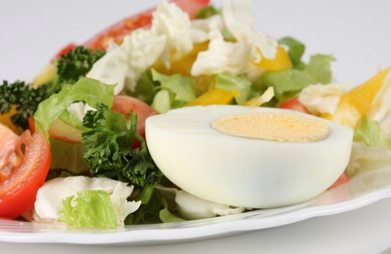 Fresh vegetable salad with boiled eggs on the Maggi diet menu